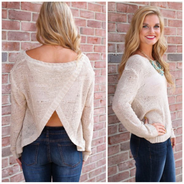 white, semi-transparent sweater with a discreetly open back and blue skinny jeans