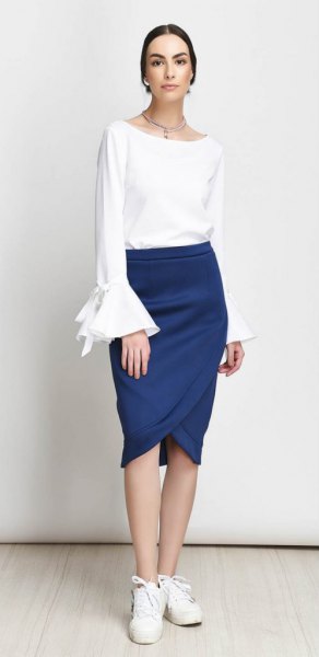 white bell sleeve top with dark blue tulip skirt