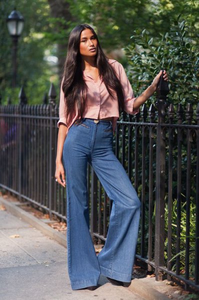 blush pink buttoned cropped shirt with blue flared jeans