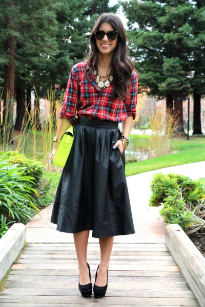 green and blue checked shirt with a black midi leather skirt