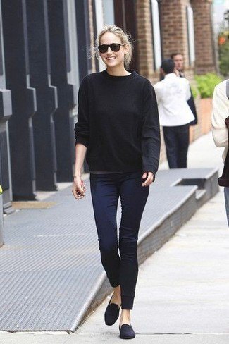 Relaxed fit black knit sweater, dark blue skinny jeans and suede loafers