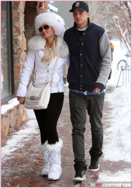 white faux fur collared coat with matching snowshoes