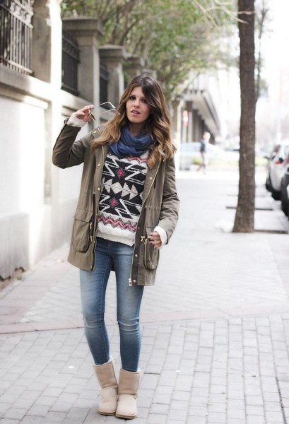 gray trench coat with tribal printed sweater and snowshoes