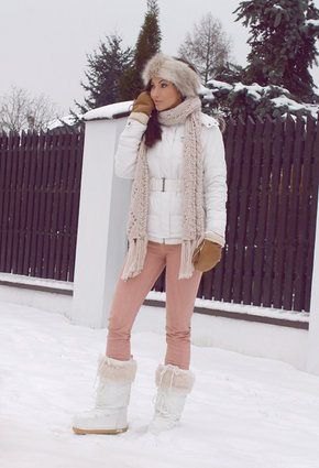 white down jacket with light gray knitted scarf and faux fur snowshoes