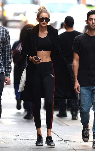 black bomber jacket with crop top and sport leggings