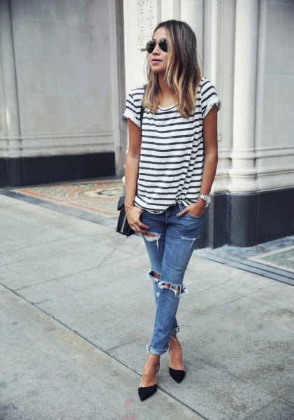 black and white striped short-sleeved t-shirt with blue jeans and heels
