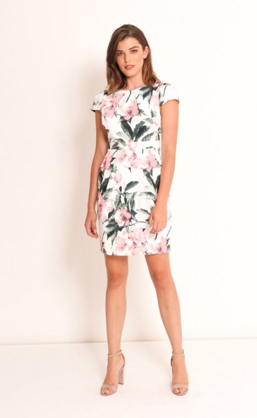 white mini tulip dress with cap sleeves and floral pattern