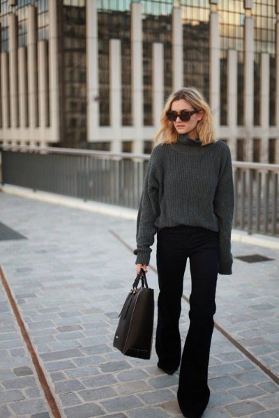 Gray chunky crew neck sweater and black flared jeans