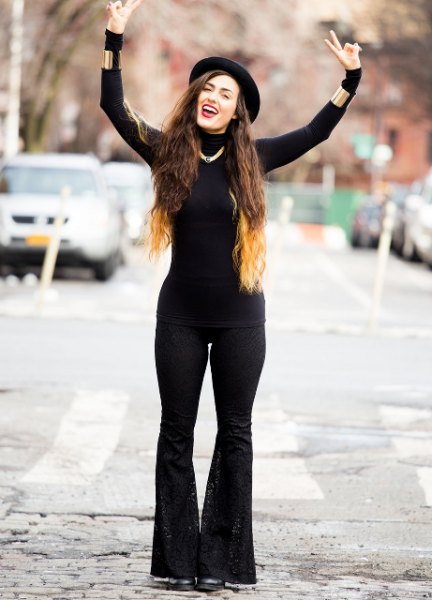 black bodycon sweater with matching flared jeans
