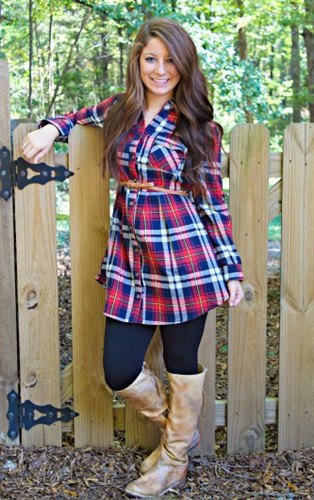 Knee high leather boots with a blue and red checked ivory tunic
