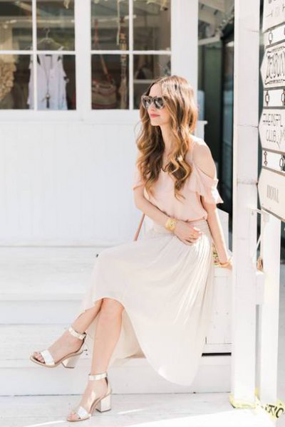 Light pink chiffon blouse with maxi white pleated skirt and gold open toe heels
