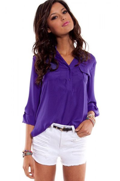 bright purple button down shirt and white mini shorts