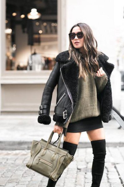 Leather jacket with faux fur collar and green ribbed sweater