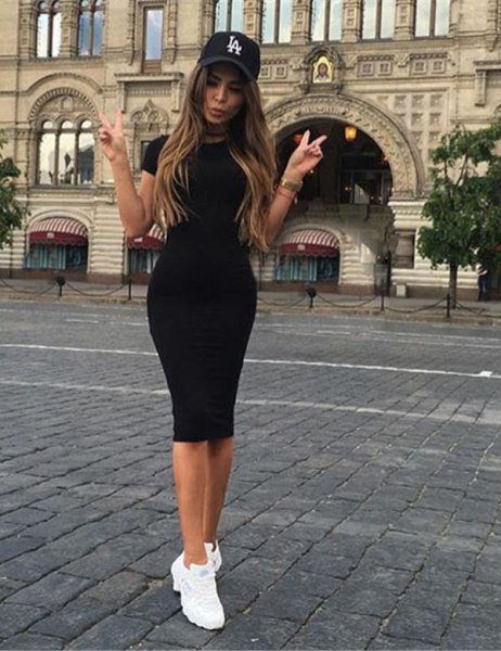 black short sleeved mini dress with baseball cap and sneakers