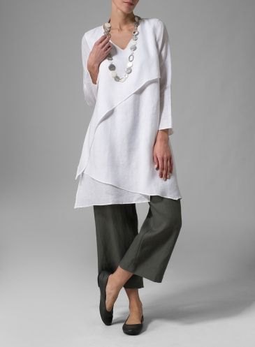 white layered tunic top with gray wide leg cropped pants