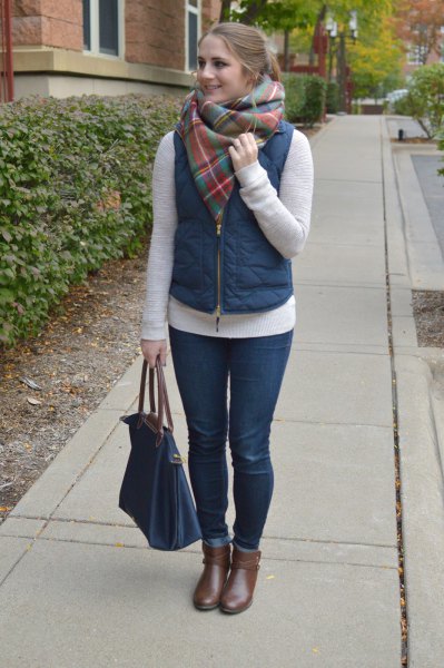 Puffer vest with a gray cashmere scarf and short gray leather boots