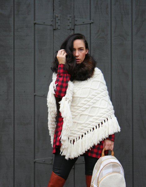 white cable knit scarf with red and black checked tunic shirt