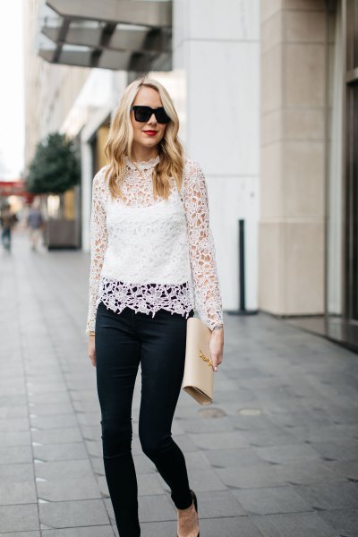 white long-sleeved lace top with stand-up collar over vest top
