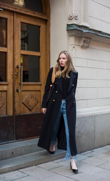 black maxi coat with turtleneck and fringed jeans