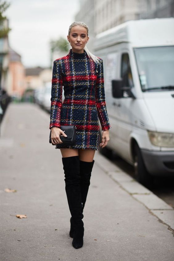 Thigh-high boots in a tweed dress