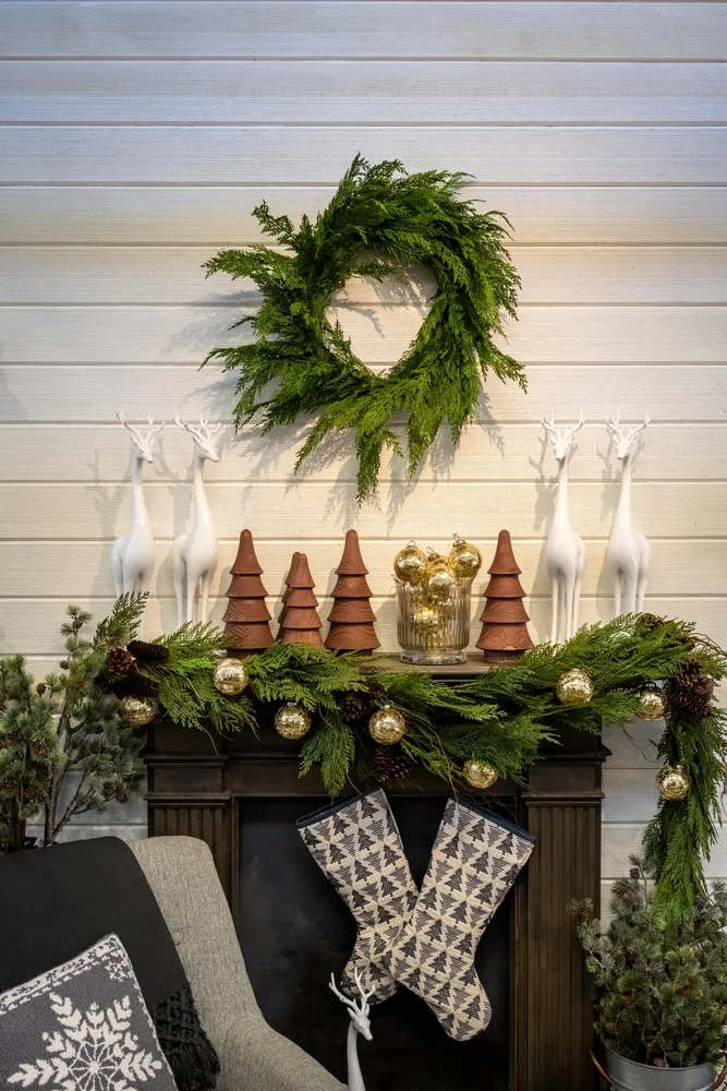 White ceramic deer and wooden cone trees