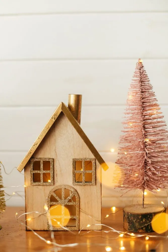 Wooden house with blush bottle brush trees