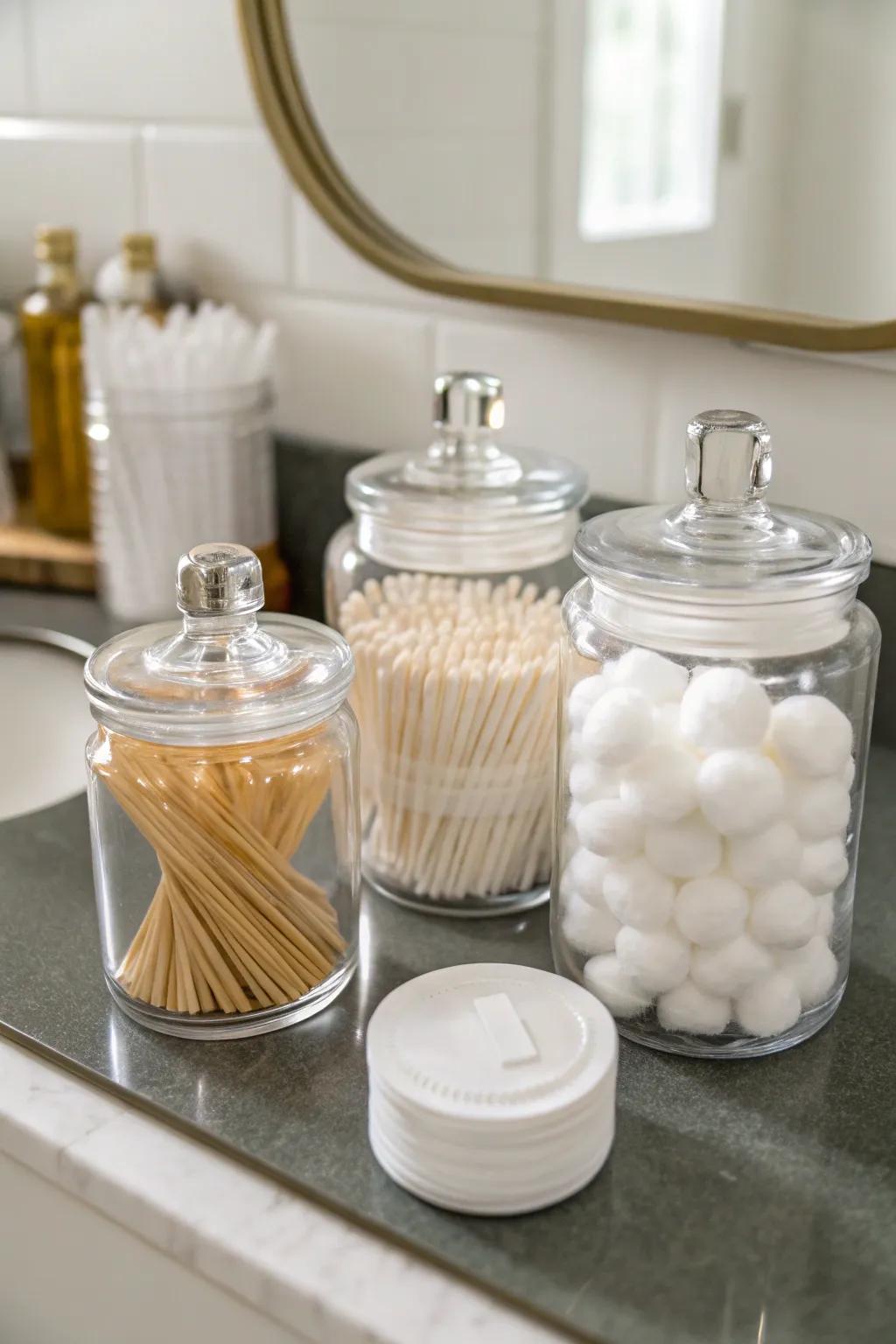 Transparent jars for bathroom essentials.