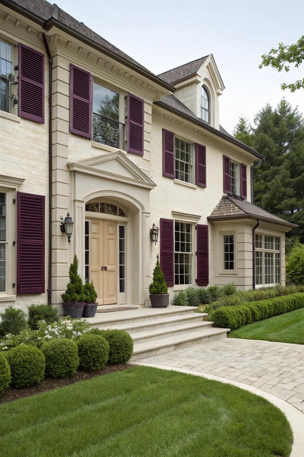 Luxurious plum shutters paired with a creamy ivory door for an elegant look.
