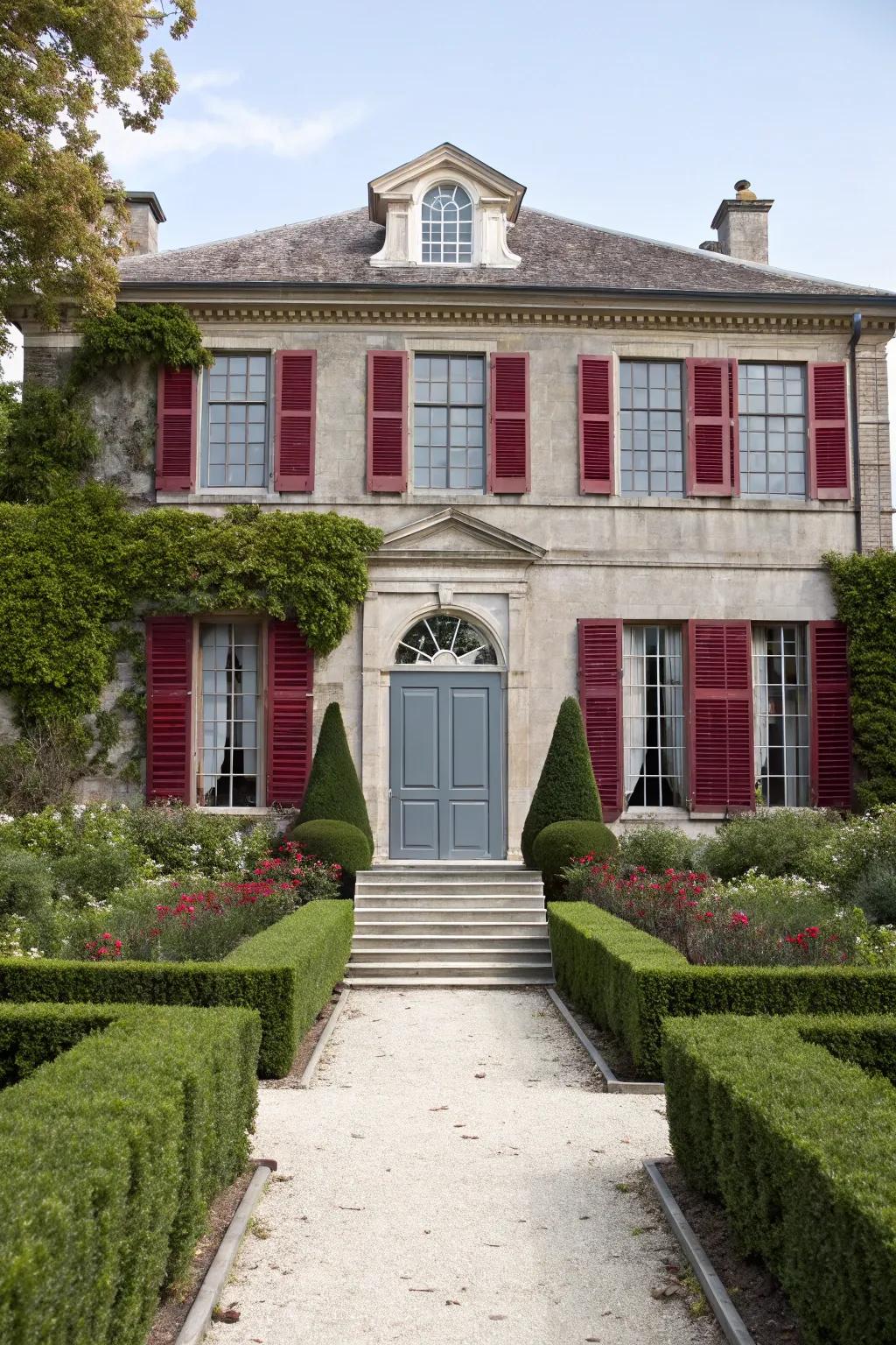 Regal burgundy shutters with a cool gray door for a sophisticated exterior.