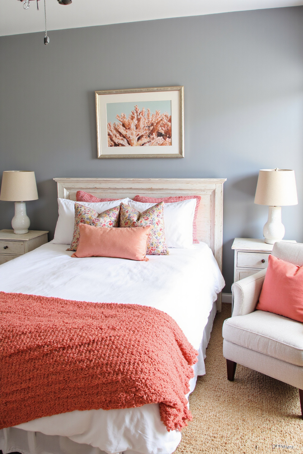 gray bedroom with coral accents and art