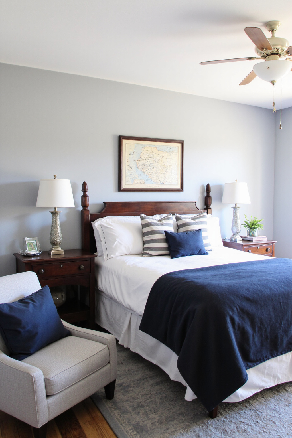 gray bedroom with navy blue accents and coastal decor