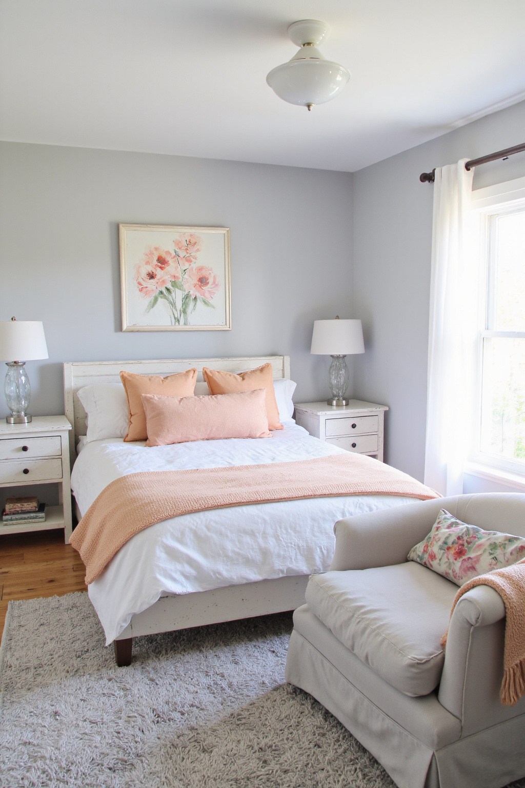 gray bedroom with peach accents and floral art