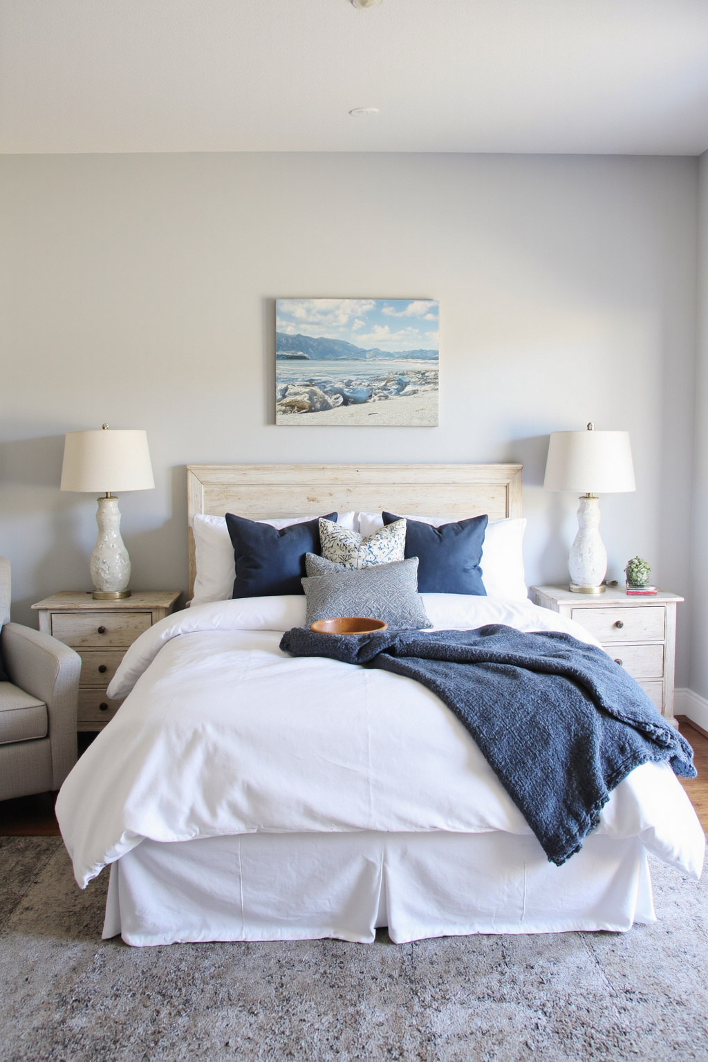 gray and blue bedroom with ocean art